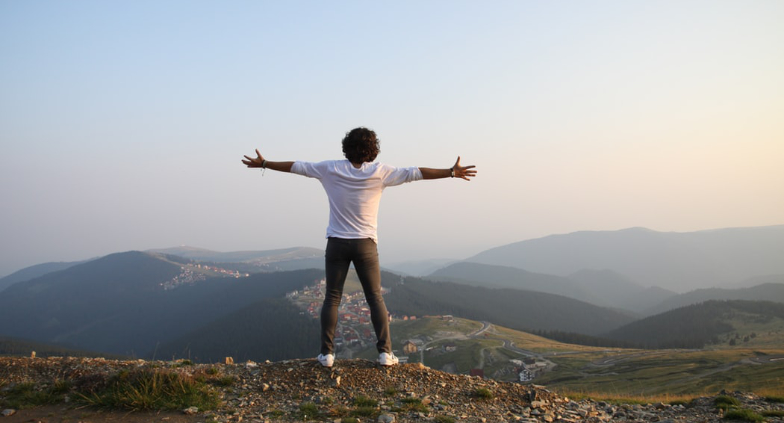 Person enjoying mountaintop view