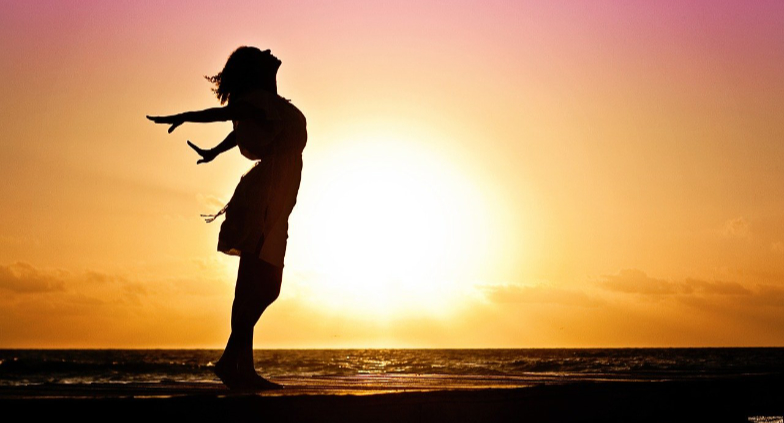 Woman enjoying the ocean breeze